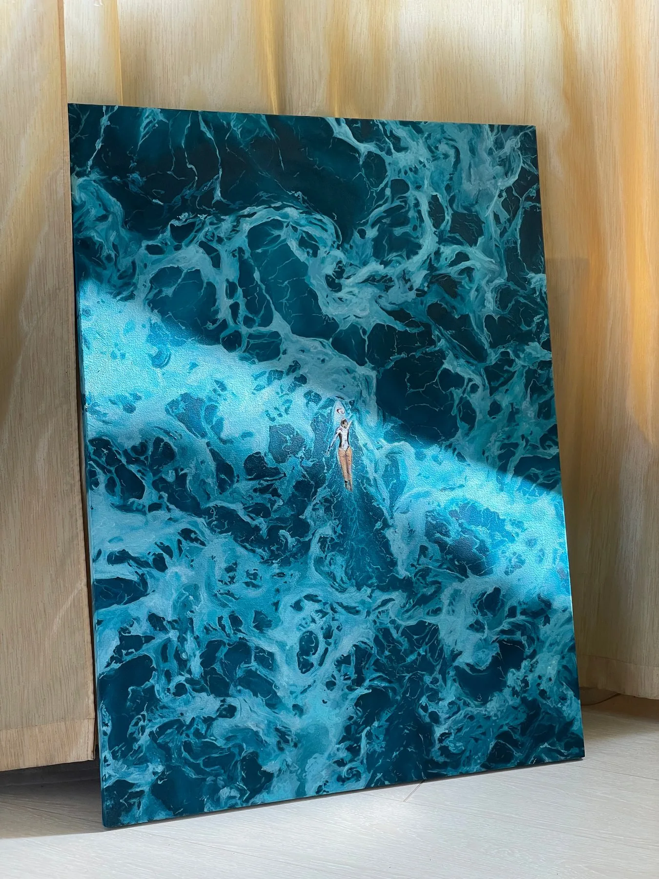 Chasing the Perfect Wave — oil painting of a surfer paddling through turquoise foam, seen from above, leaning against a wall in sunlight