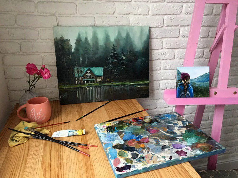 Studio desk with The Hermit's House, a palette and brushes