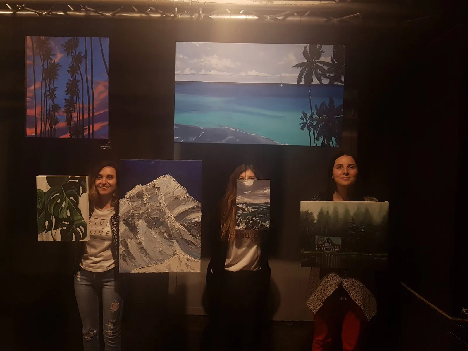 Kate's paintings at a night exhibition
